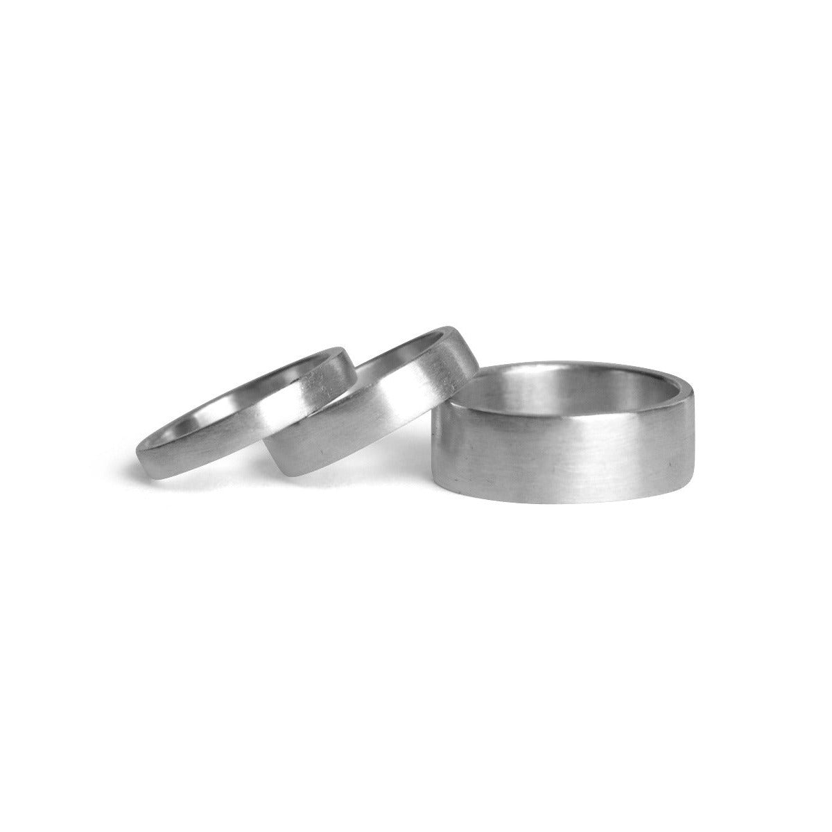 Two silver rings on a white background