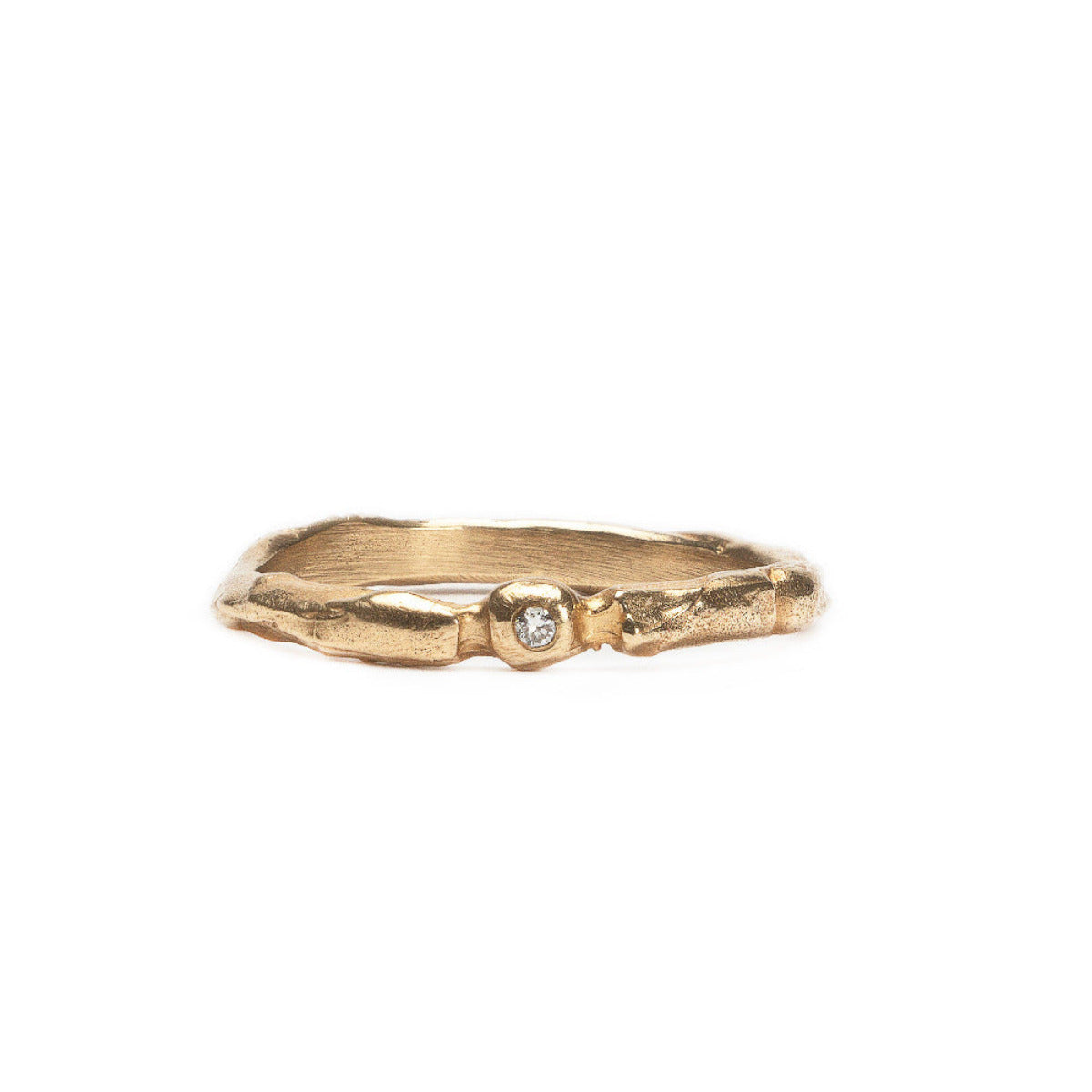Gold ring with a diamond on a white background